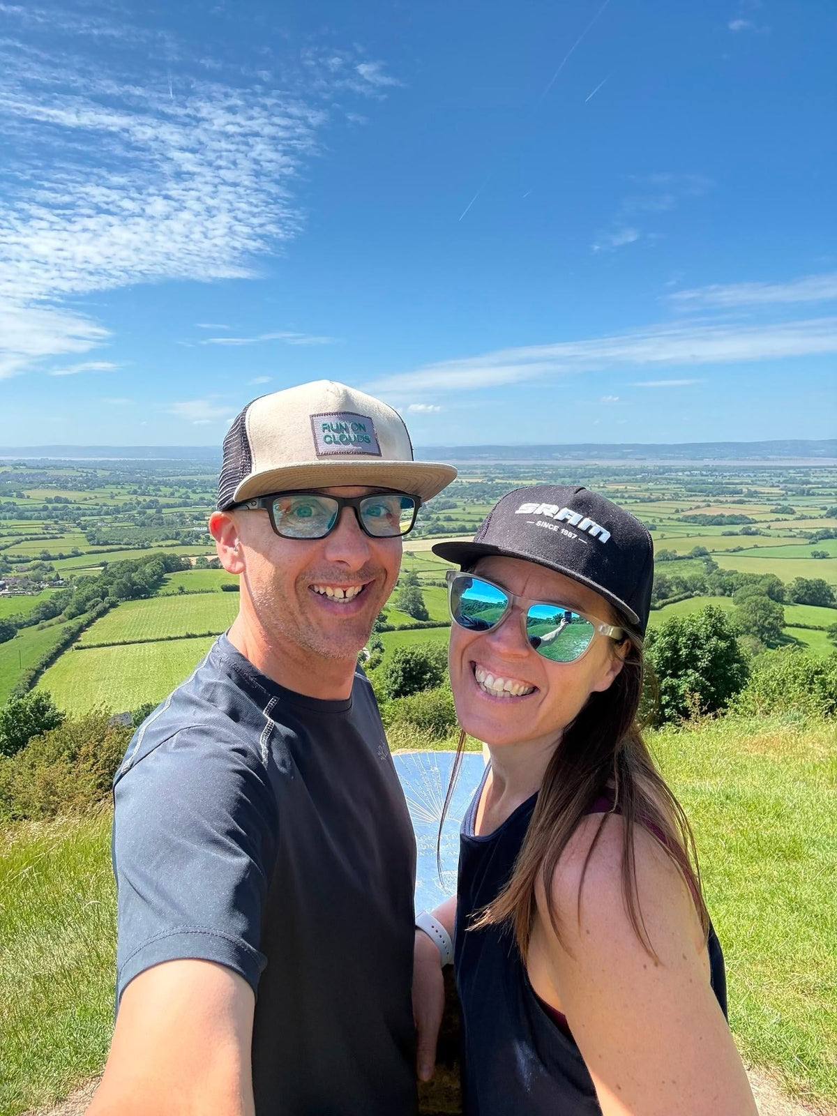 Gary and Lou together in front of green hills